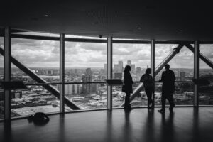 In a Balcony 03 person are standing and talking 